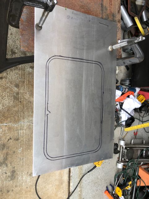 1992 Jeep Wrangler - Sheet metal is prepared with a template for a cut-out, secured with clamps on a workbench.