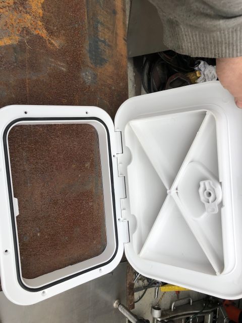 1992 Jeep Wrangler - A white boat hatch is shown open, revealing its internal structure and a rubber gasket for sealing.