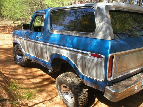 1978 Ford Bronco - This 1978 Ford Bronco is shown in a three-quarter rear view, highlighting its two-tone paint and off-road tires.