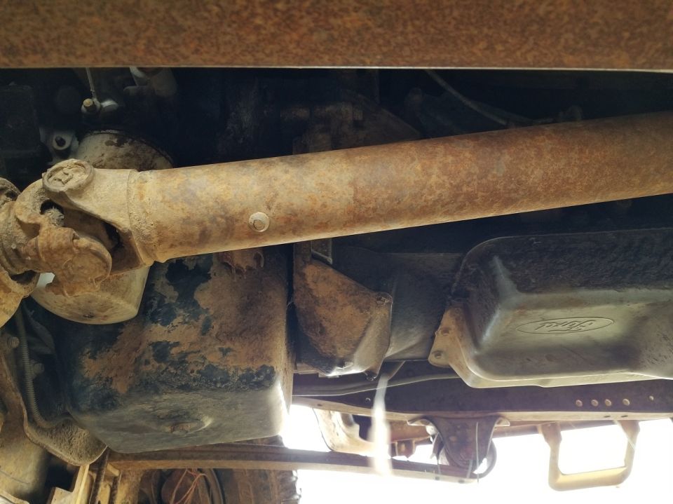 Left frame forward
_________________________________________
OASIS 3821	1999-2003 VARIOUS VEHICLES - ENGINE - 7.3L - OIL PAN CORROSION - SERVICE TIP

SOME VEHICLES EQUIPPED WITH THE 7.3L DIESEL ENGINE MAY EXHIBIT ENGINE OIL PAN CORROSION WHEN OPERATED IN HIGH SALT CONTENT/CORROSIVE ENVIRONMENTS. SEE TSB 02-20-05 ON OASIS AND QCDEALER.COM FOR DETAILS.