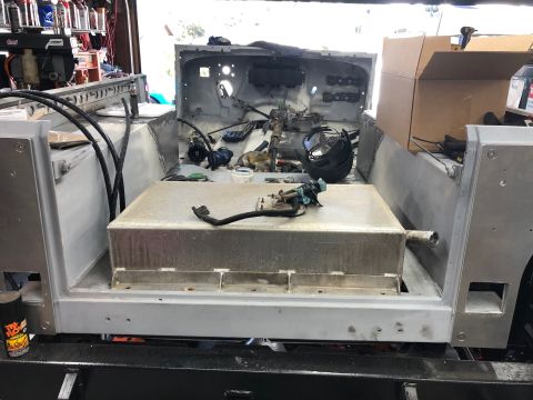 1992 Jeep Wrangler - The interior of a Jeep Wrangler is shown during a restoration or modification process. A large fuel tank is installed in the rear, with var…