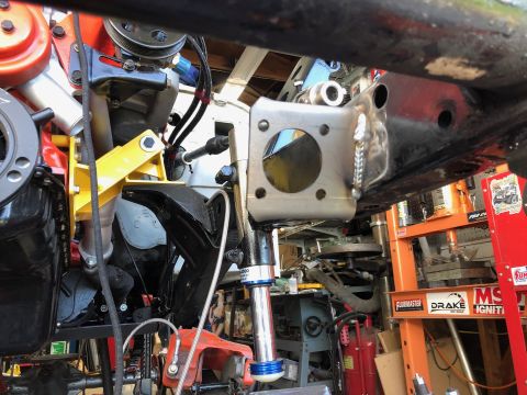 1992 Jeep Wrangler - A close-up view of a custom fabricated bracket welded to a black metal frame, likely part of a vehicle's suspension or engine mount. The br…