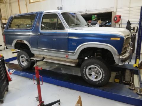 1996 Ford Bronco - This 1996 Ford Bronco is shown on a lift, likely for maintenance or inspection.