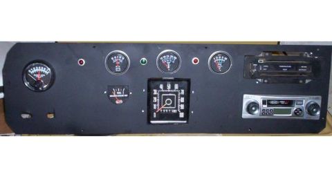 1978 Ford Bronco - This custom dashboard panel features a variety of gauges, a speedometer, and two aftermarket radios, likely for a modified vehicle.