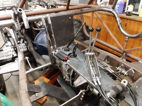 1985 Toyota Hilux - Interior view of a custom-built vehicle with a visible transmission and shifter setup.