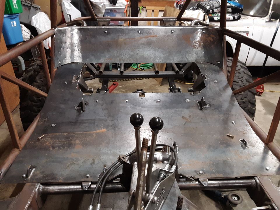 Custom buggy interior with dual shifters and unfinished metal floor