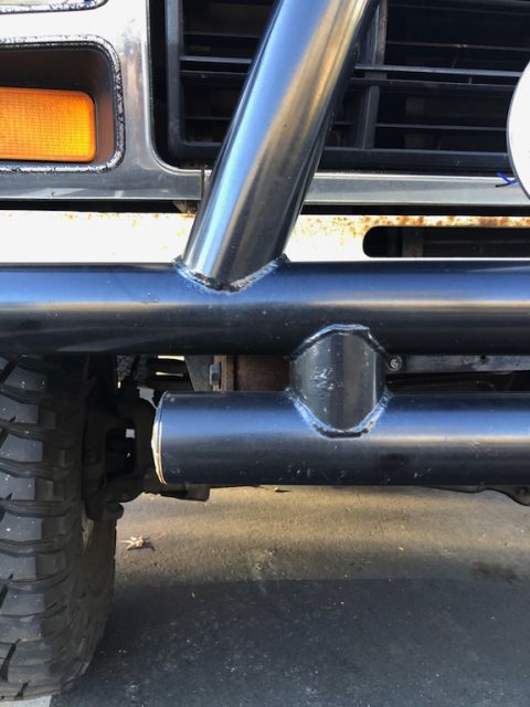 1981 Ford Bronco - Close-up view of the front of a Ford Bronco, highlighting its grille and a custom roll cage.