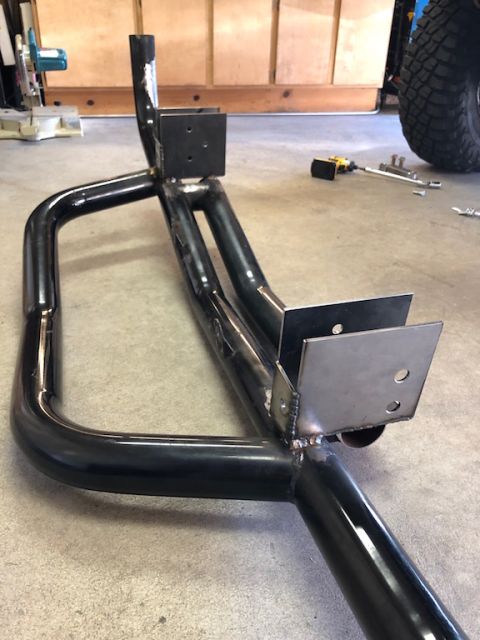 1981 Ford Bronco - Custom off-road bumper fabricated from steel tubing, shown on a garage floor.