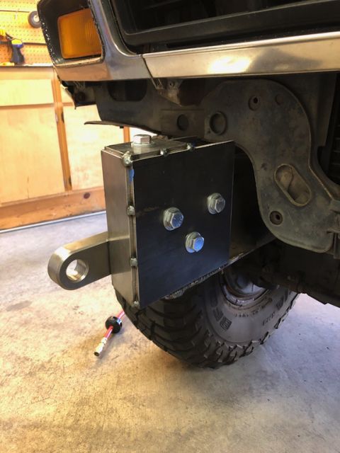 1981 Ford Bronco - Close-up of an aftermarket bumper mount and tow hitch receiver on a 1980s Ford Bronco.