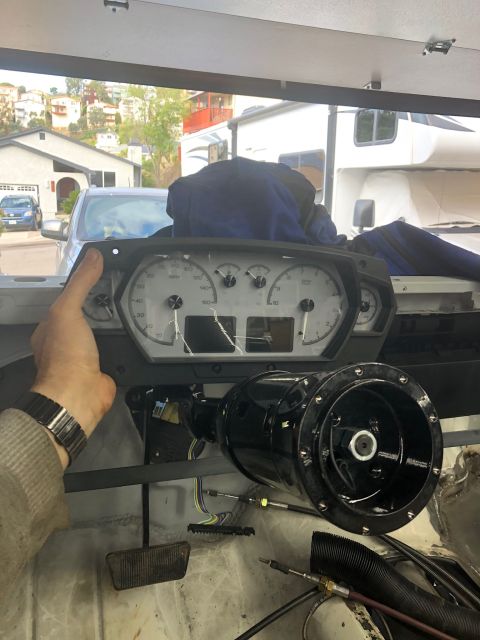 1992 Jeep Wrangler - Instrument cluster and steering column assembly being worked on, with wiring and pedals visible.