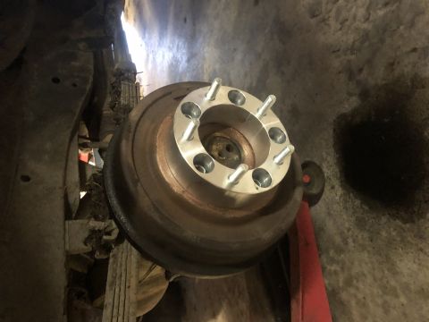 1979 Ford Bronco - A wheel spacer is shown installed on the brake rotor of a vehicle, likely for modification.