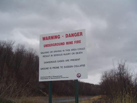 1979 Ford Bronco - Roadside Pennsylvania DEP sign reading "WARNING - DANGER UNDERGROUND MINE FIRE," warning that walking or driving in the area could cause se…