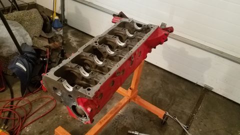 1985 Ford Bronco - Engine block on a stand, likely for repair or rebuilding.