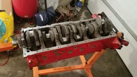 1985 Ford Bronco - Engine block and crankshaft assembly on an engine stand, likely for repair or rebuild.