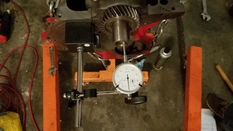 1985 Ford Bronco - Dial indicator used to measure gear runout on an engine block during repair.