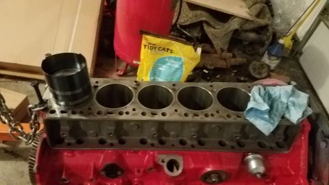 1985 Ford Bronco - Engine block and piston ring compressor tool, with Tidy Cats litter bag visible in the background.