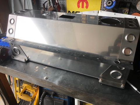 1992 Jeep Wrangler - A custom-fabricated aluminum or stainless steel fuel tank or storage box is shown mounted on a workbench. The box has multiple circular cut…