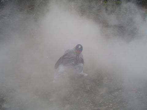 1979 Ford Bronco - A person is obscured by dense smoke, with a website logo visible in the lower right corner.