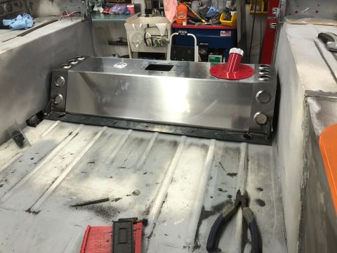 1992 Jeep Wrangler - A custom aluminum fuel tank is installed in the bed of a vehicle, likely a Jeep Wrangler. The tank has multiple circular fittings on its si…