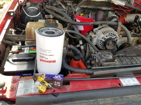 1997 Ford F-250 - It took a large filter wrench to get the old one ( FL1995 ) off, but no tools should be needed again to change the oil (4 gallons of Rotell…