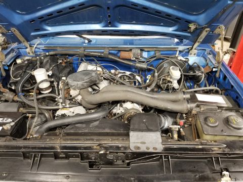 1989 Ford Bronco - Engine bay Typical dry-rot of cowl seal.