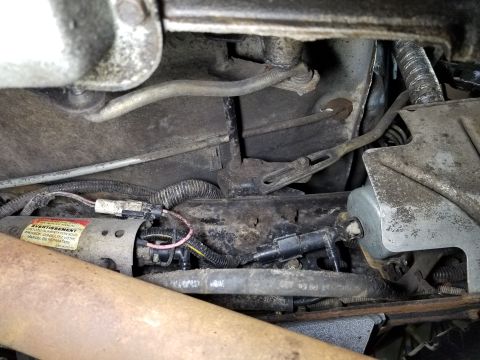 1989 Ford Bronco - Shifter equalizer, speedo cable, high-pressure fuel pump, and fuel filter (behind the heat shield). I've never seen fuel lines wrapped like…