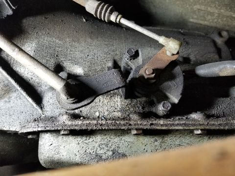 1989 Ford Bronco - C6 shift & kickdown levers. The PNP switch is behind them.