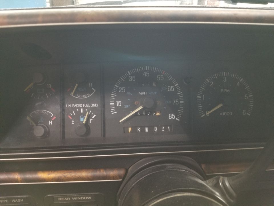 Dashboard gauges showing fuel, oil pressure, speedometer, and RPMs. Odometer reads 007749