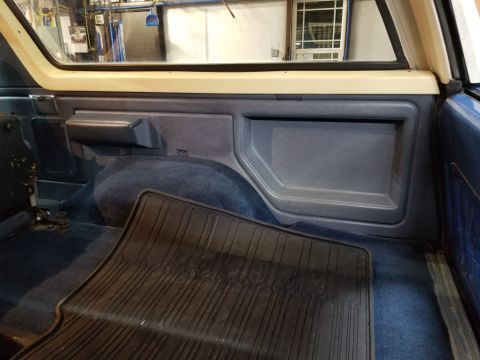 1989 Ford Bronco - The cargo carpet is replacement, but made fairly well. It was cut instead of being installed under the seat brackets; and the wheelwell car…