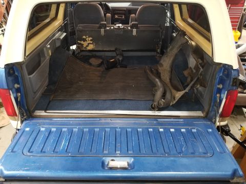 1989 Ford Bronco - The cargo carpet is replacement, but made fairly well. It was cut instead of being installed under the seat brackets; and the wheelwell car…