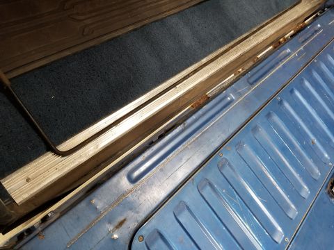 1989 Ford Bronco - Typical rust at the bottom of the t/g, plus a hole in the access panel.