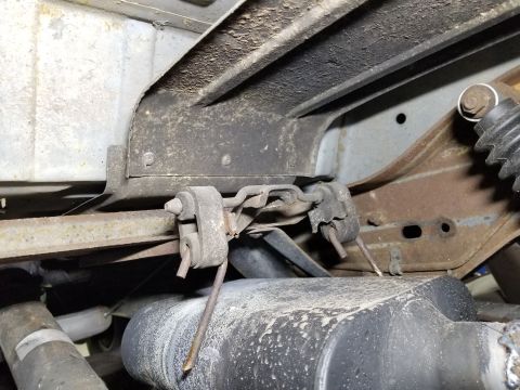 1989 Ford Bronco - The original muffler hangers were left beating against the new muffler, which is probably producing some noise in the cabin.