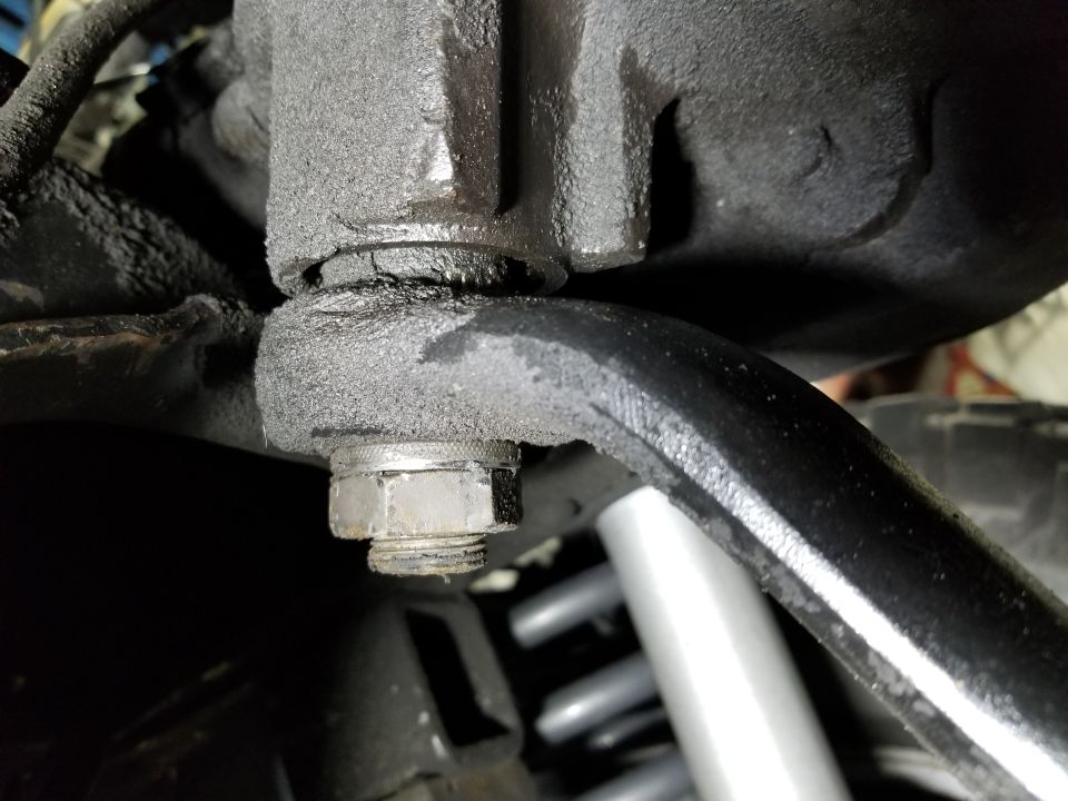 The pitman arm nut was so loose that the arm was moving on the splines. Note that the top 3 threads are clean because the nut was that far down.