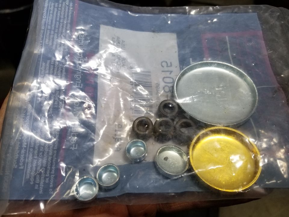 Remaining plugs from kit. Small & tiny plugs don't appear to apply to this engine, which has 5 threaded plugs (none leaking).