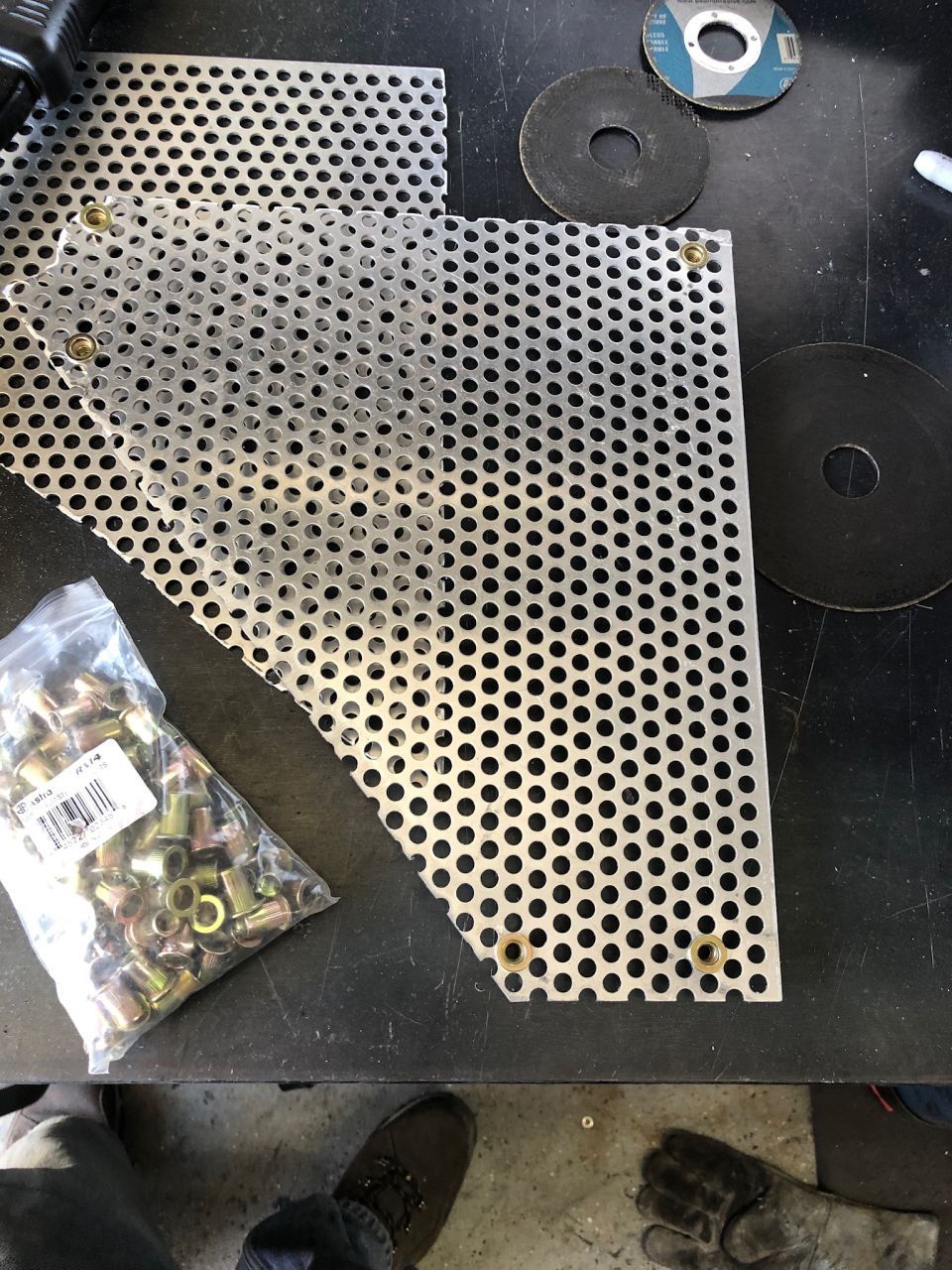 Bag of rivet nuts and perforated metal sheeting