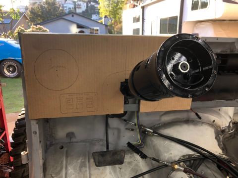 1992 Jeep Wrangler - A cardboard template is placed over the dashboard of a Jeep Wrangler, showing cutouts for a 5" speaker and three switches. A black steering…