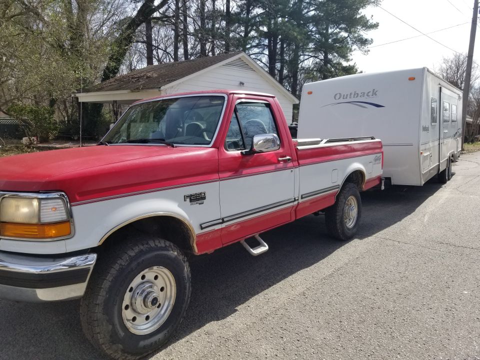 1997 Ford F-250 XLT towing an Outback travel trailer
