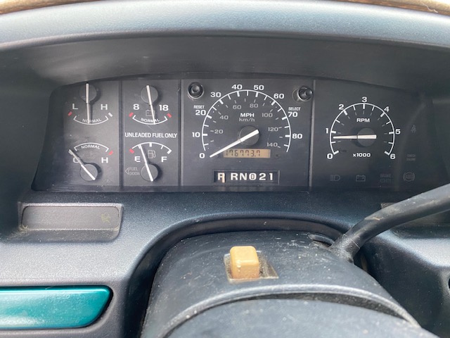 Close-up of a 1996 Ford Bronco instrument cluster showing gauges and odometer reading 176,773.7 miles.