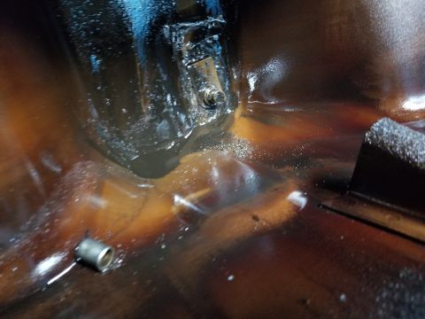 1996 Ford Bronco - The pan gasket was pretty ugly, so I dropped the pan. The inside was pretty ugly, too. That's one of the timing cover dowels rolling around…