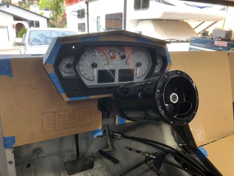 1992 Jeep Wrangler - A custom dashboard is being fabricated for a vehicle, featuring a digital gauge cluster and a black steering column. Cardboard templates an…