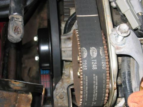 1993 Ford F-150 - Close-up view of a Gates T248 timing belt and associated pulleys within an engine compartment.