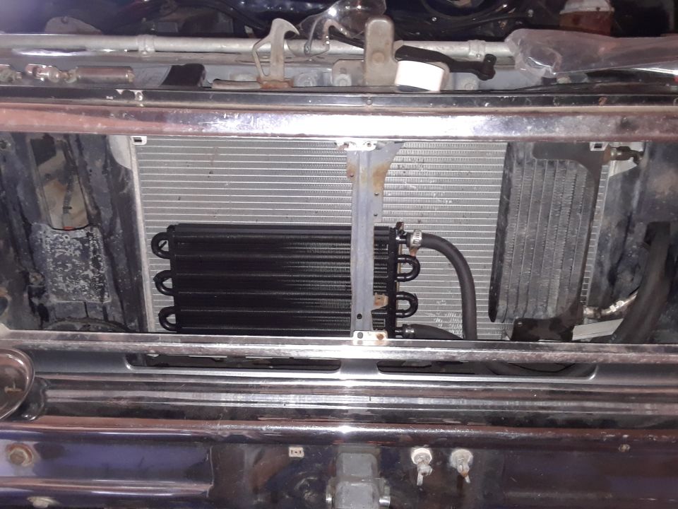 Vehicle radiator and transmission cooler installed in front of chrome bumper and grille.