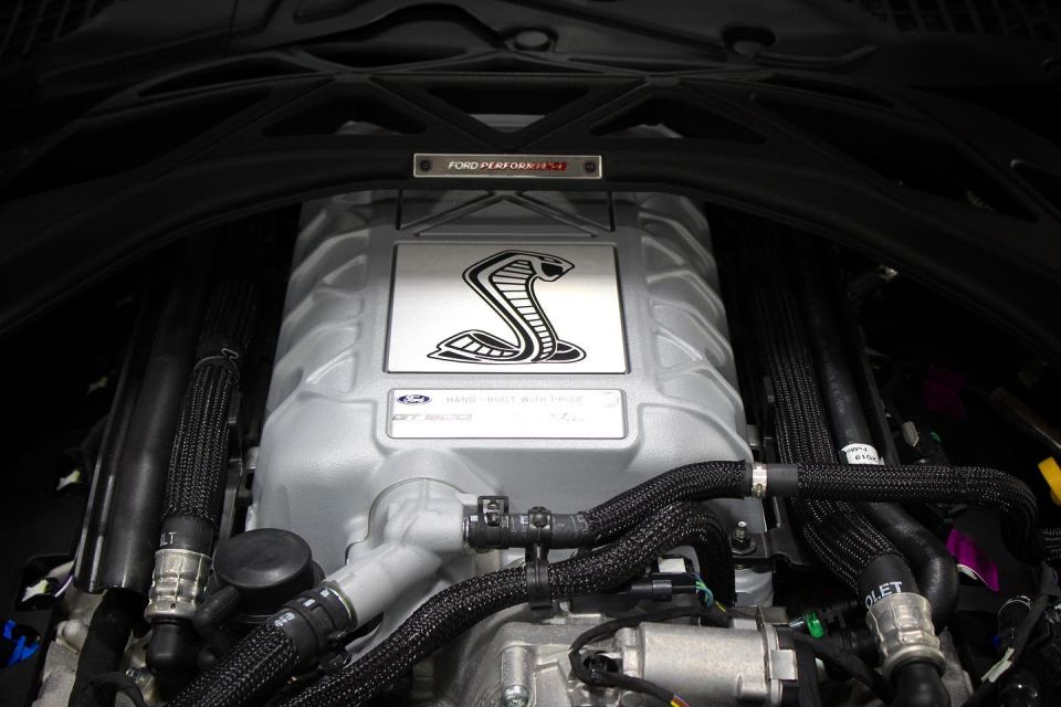 Ford Performance supercharged engine with cobra emblem and GT500 text.