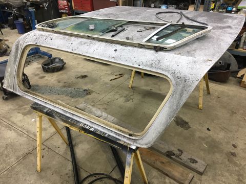 1979 Ford Bronco - the rubber seals are so dry that they had to be cut all the way around to get the frame out of the top.
