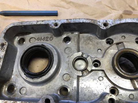 1980 Ford Bronco - Close-up view of a metal engine component with visible markings and seals.