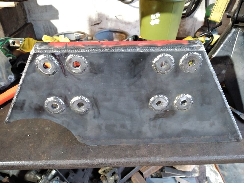 Welded metal part with eight bolt holes