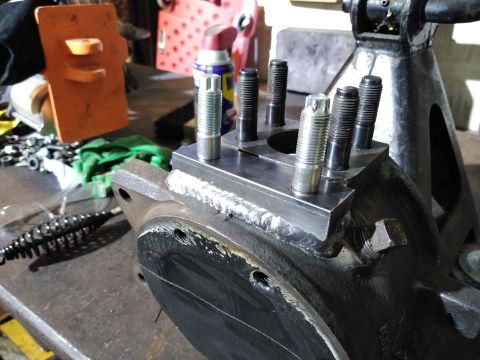 1985 Toyota Hilux - A close-up view of a welded differential housing with several studs installed.