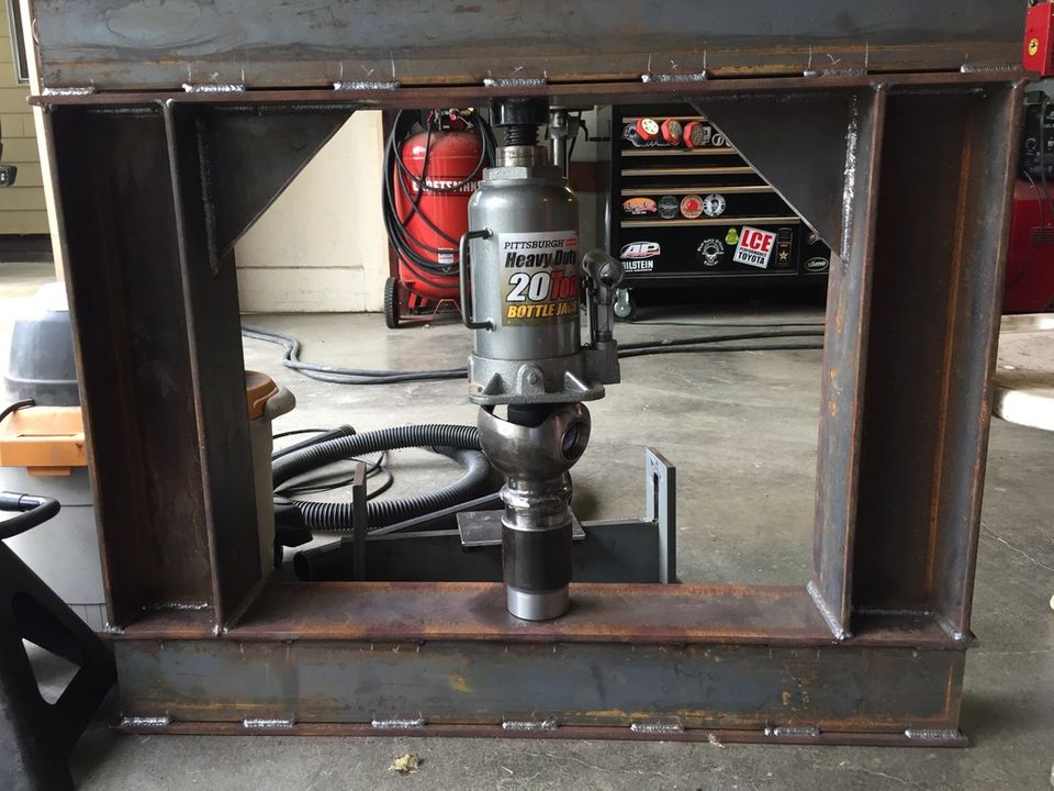 Hydraulic press frame with a 20-ton bottle jack in the center