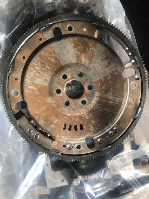 2000 Ford Explorer - Close-up of a used flywheel, likely for an automatic transmission.