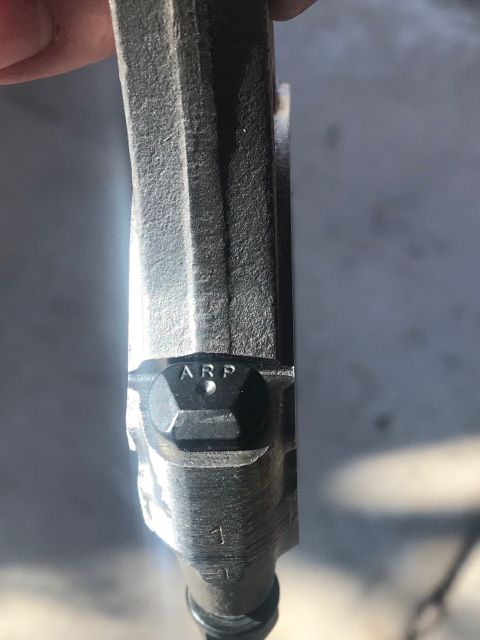 2000 Ford Explorer - This image shows a close-up of an engine connecting rod, identified by the 'ARP' marking.